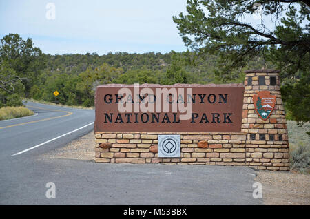 Along Highway 64, the Desert View/  East Entrance Sign welcomes visitors to Grand Canyon National Park. Then, they are met by a set of drive-through entrance booths clad with arcing stone walls, recalling the construction of the Desert View Watchtower, in a modern interpretation that incorporates exposed steel columns and beams.  Grand Canyon National Park East Entrance Sign . Stock Photo