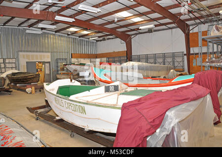 Grand Canyon History Symposium Historic Boat Tour . View of historic boats, WEN and Music Temple, in the museum colleciton storage area. [The boat in the foreground is white with green inside side walls, name lettered on the outside side wall, and with red cloth covers that are pulled back during viewing]  The Grand Canyon Historical Society [GCHS] held the 4th Grand Canyon History Symposium on the  South Rim, Grand Canyon National Park, on Novemb Stock Photo