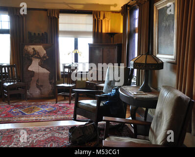 Grand Canyon History Symposium Historic Kolb Studio . View of residence living room with photograph of Kolb brothers dangling from ropes between a gap in Stock Photo