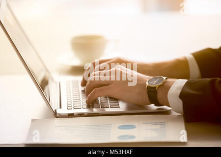 Male business leader using computer at office desk Stock Photo