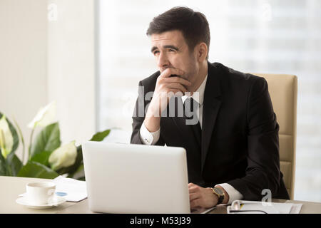 Company manager feeling sleepy at workplace Stock Photo