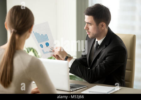 Boss talking about company financial perspectives Stock Photo
