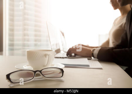 Female and male company employees using computers Stock Photo