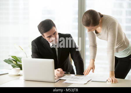 Colleagues architects working together on drawings Stock Photo