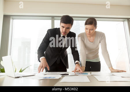 Team of young architects working on new project Stock Photo