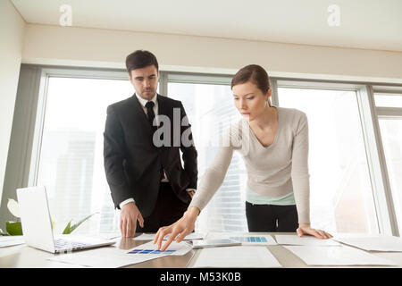 Woman choosing paint color with interior designer Stock Photo