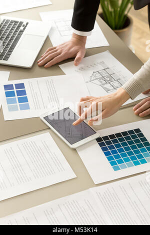 Architects colleagues working together on project Stock Photo