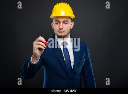 Successful architect writing on transparent glass doing a working plan Stock Photo