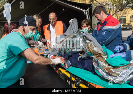 Thessaloniki, Greece - Feb 16, 2018: Salvation crews evacuate patients and injured in hospital AXEPA during exercise for earthquake Stock Photo