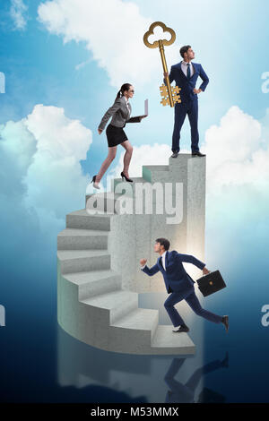 Businessman with key to success at the top of career Stock Photo - Alamy
