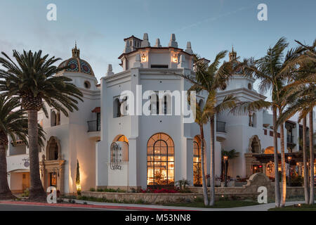 The front facade of a hotel featuring many architectural elements Stock Photo