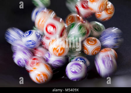 Colourful lottery balls in a machine Stock Photo