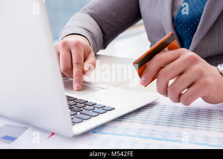 Male businessman doing online shopping with credit card Stock Photo