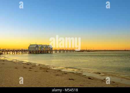 Scenic landscape of iconic Busselton Jetty in Busselton Beach, Western Australia at sunset light. Busselton Jetty is the longest wooden pier in the world. Copy space. Stock Photo