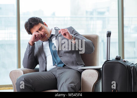 Young businessman in airport business lounge waiting for flight Stock Photo