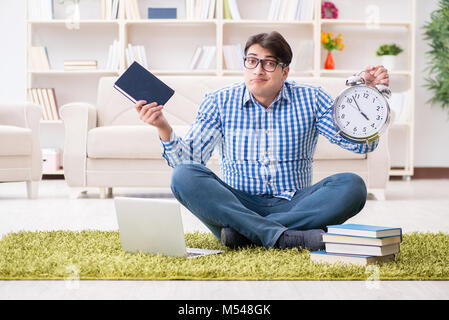 Young handsome man sitting on floor at home Stock Photo