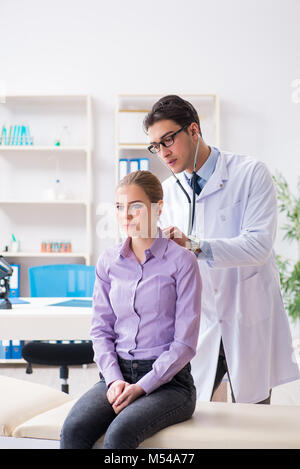 Patient visiting doctor for medical check-up in hospital Stock Photo
