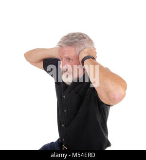 Man holding his hands over his ears Stock Photo
