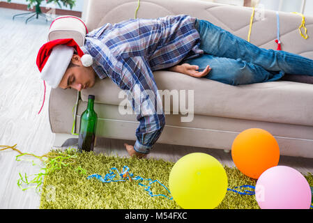 Man having hangover after christmas party Stock Photo