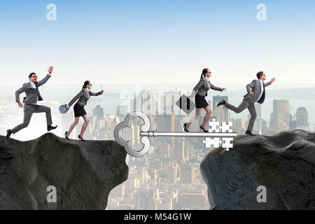 Business people chasing each other towards key to success Stock Photo