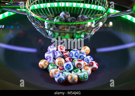 Colourful lottery balls in a machine Stock Photo