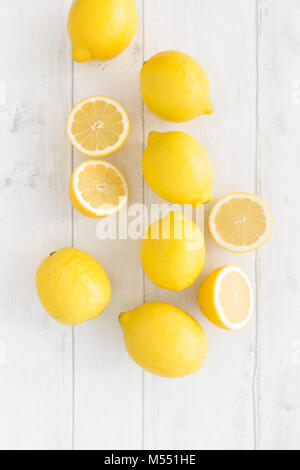 Composition of lemons on white wood background. Top view. Stock Photo