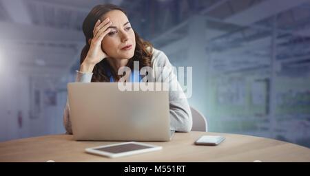 Businesswoman working on laptop Stock Photo