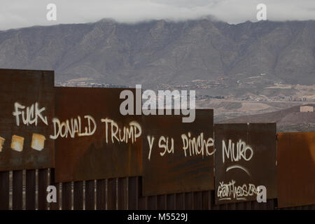 Anti-Trump graffiti on Mexican Side of Border Wall between El Paso, Texas and Juarez, Chihuahua, 2018. Stock Photo