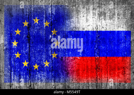 EU and Russia flag on concrete wall Stock Photo