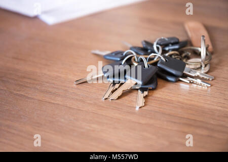 A lot of key chain on desk office with meeting document Stock Photo