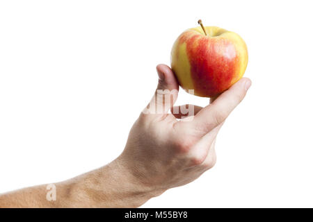 an apple holding by a male hand Stock Photo