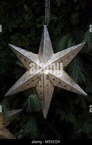 Festive silver star for Christmas tree on black background Stock Photo ...
