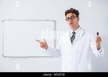 Funny doctor scientist making presentation in hospital Stock Photo