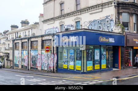 Brighton UK 20th Feb 2018 - A branch of the William Hill bookmaker firm on the corner of Sillwood Road and Western Road in Brighton this morning . The well known betting company has been hit with a £6.2m penalty package for breaching anti-money-laundering and social responsibility regulations  Credit: Simon Dack/Alamy Live News Stock Photo