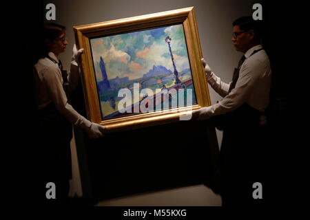 London, UK. 20th February, 2018. Employees pose with oil painting 'Londres : la Tamise au pont de Westminster' by artist Andre Derain at Christie's auction house in London Tuesday February 20, 2018.  The artwork, estimated at £9million, will be sold at the Impressionist and Modern Art evening sale on February 27.    Credit: Luke MacGregor/Alamy Live News Stock Photo