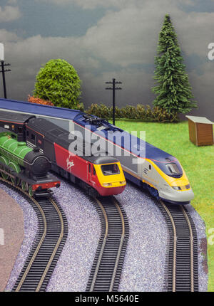 Model toy train set with three trains. Stock Photo
