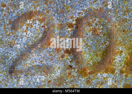 Number ‘20’ pressed in  corroded, rusty galvanized iron Stock Photo