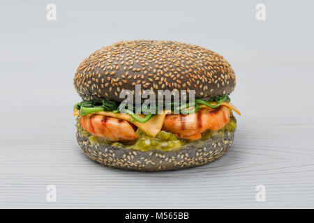 fresh chicken grill burger with spinach, pickled cucumber and cheeseon white background Stock Photo