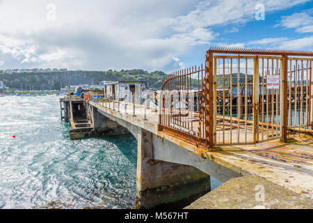 Dilapidated, disused harbour staging in Brixham harbour, South Devon, UK. Stock Photo