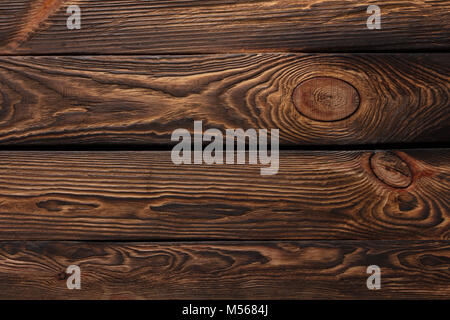 Texture of boards of dark old brown wood Stock Photo
