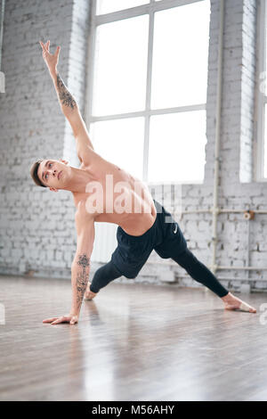 Handsome ballet dancer training in the gym Stock Photo