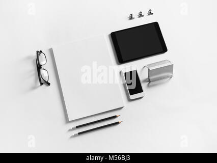 Blank stationery and gadgets Stock Photo