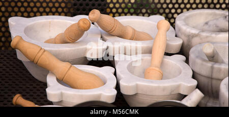 Marble mortars with pestle for genoa pesto sauce, italian cousine. Stock Photo