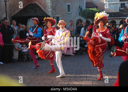 Actors in costumes dancing in the parade in Euro Disney, Paris, France Stock Photo