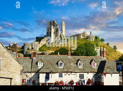 Medieval Corfe castle keep & battlements at sunrise, built in 1086 by William the Conqueror, Dorset England
