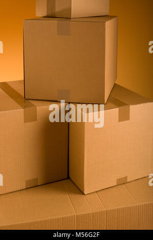 Boxes in an empty room representing concept of home moving Stock Photo