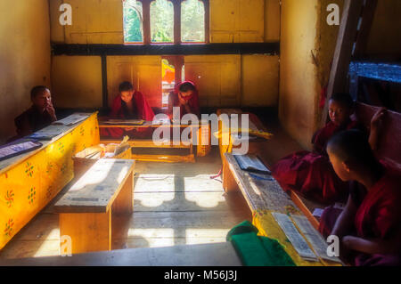 Bhutanese Students studying religious scriptures, Buddhism in Dechen Phodrang monastery near Thimphu, Bhutan Stock Photo