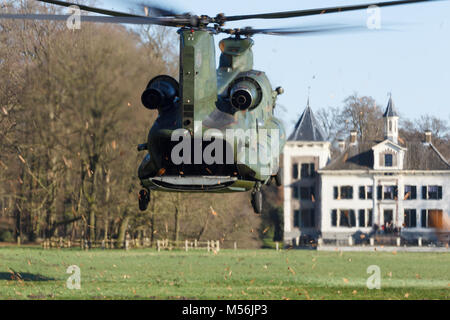 Olst Feb 7 2018: Amry and Air Force helicopter exercise. Chinook landing to drop soldiers Stock Photo