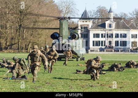 Olst Feb 7 2018: Amry and Air Force helicopter exercise. Chinook landing to drop soldiers Stock Photo