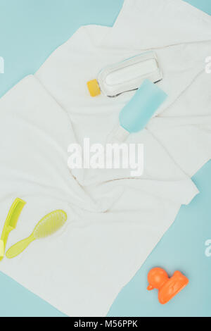 top view of baby bathroom accessories isolated on blue Stock Photo